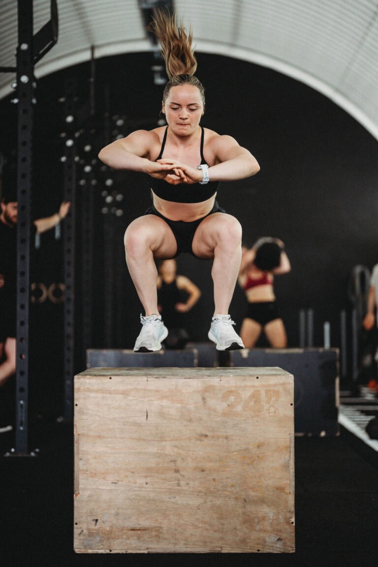 Erin Dodds performing a box jump to a 24 inch platform in Results Gym Aberdeen